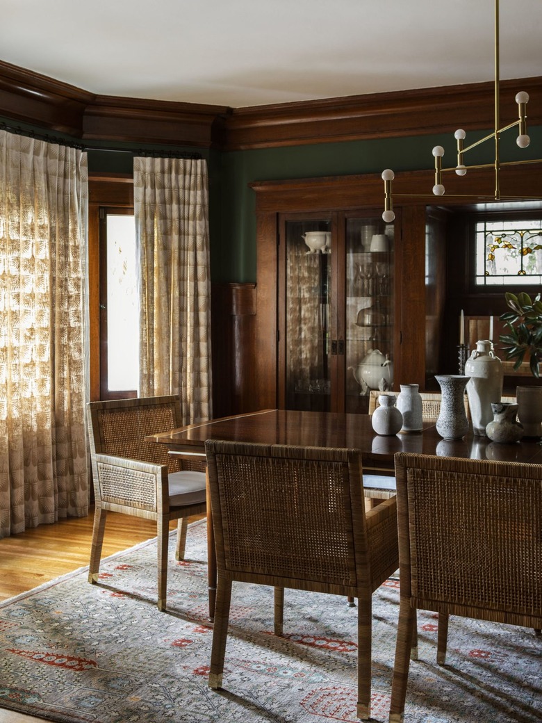 green dining room walls with taupe and white curtains