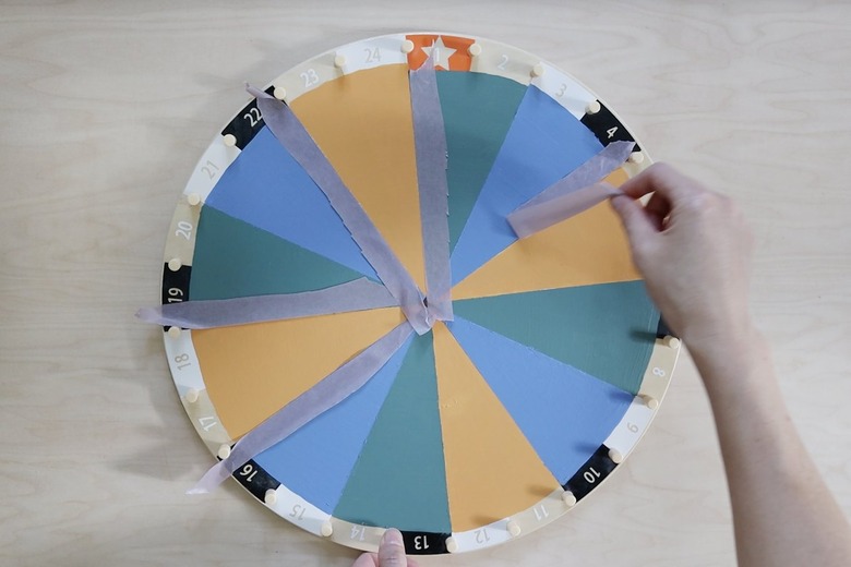 Pulling tape off painted IKEA kids activity wheel