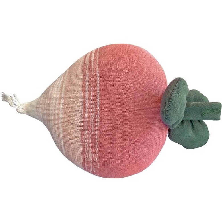 A pink radish pillow that fades to white. On top