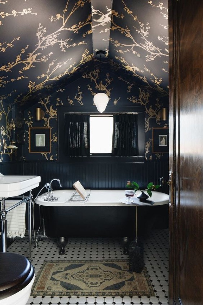 dark bathroom with wallpaper on walls and ceiling