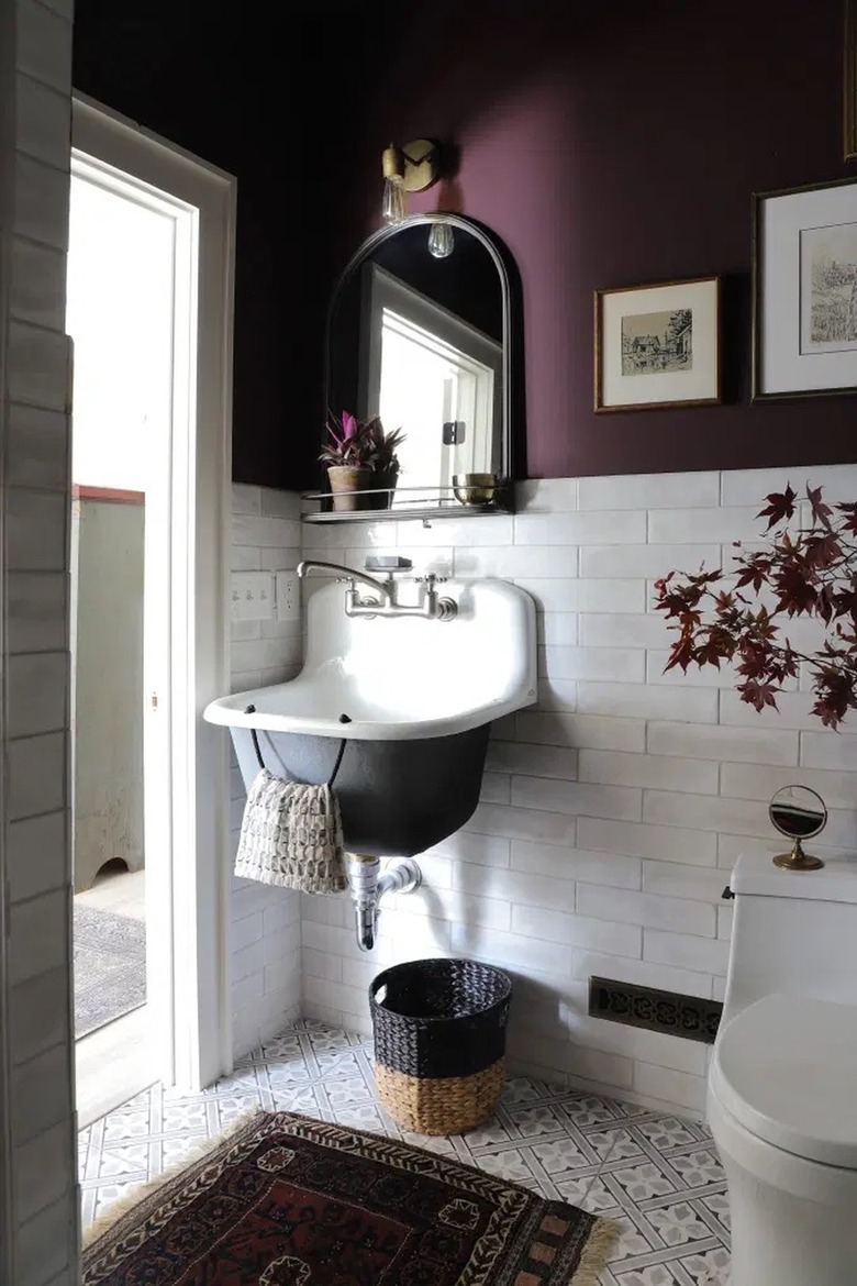 eggplant wall paint with white subway tile