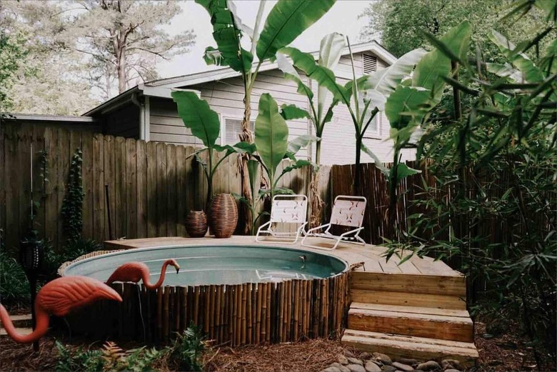 stock tank above ground pool with deck