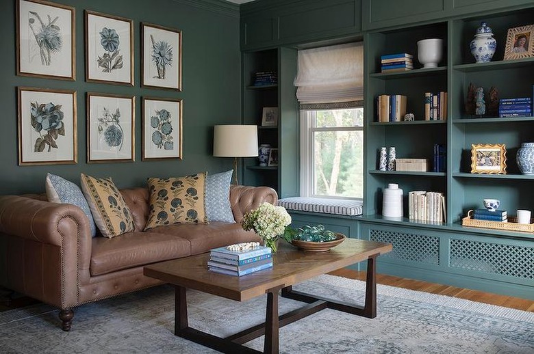 brown leather sofa in green room