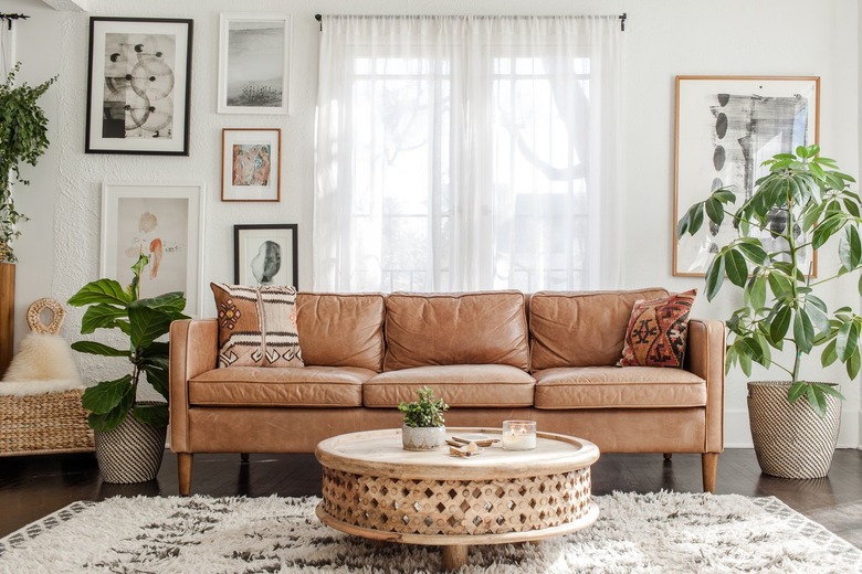 brown leather sofa in white and tan room