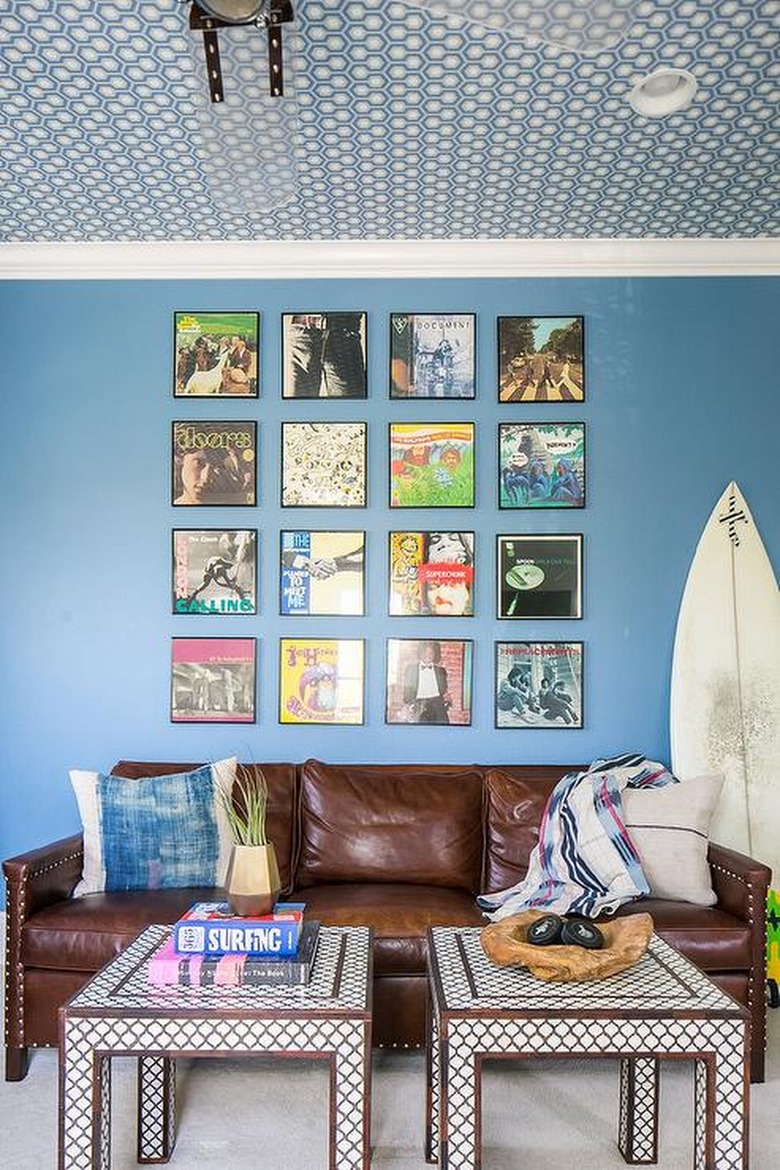 brown leather sofa in blue room