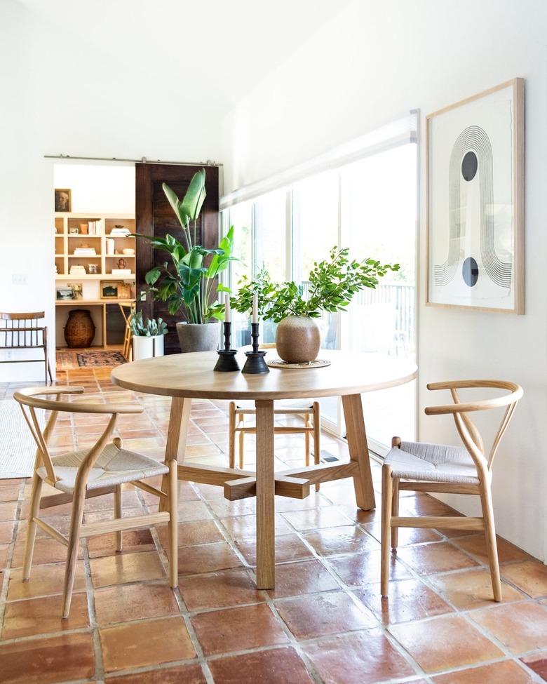 Wood dining room table with stone candlesticks.