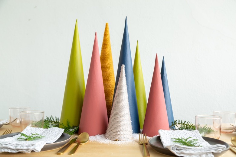 a diy holiday centerpiece made of colorful cardboard cones
