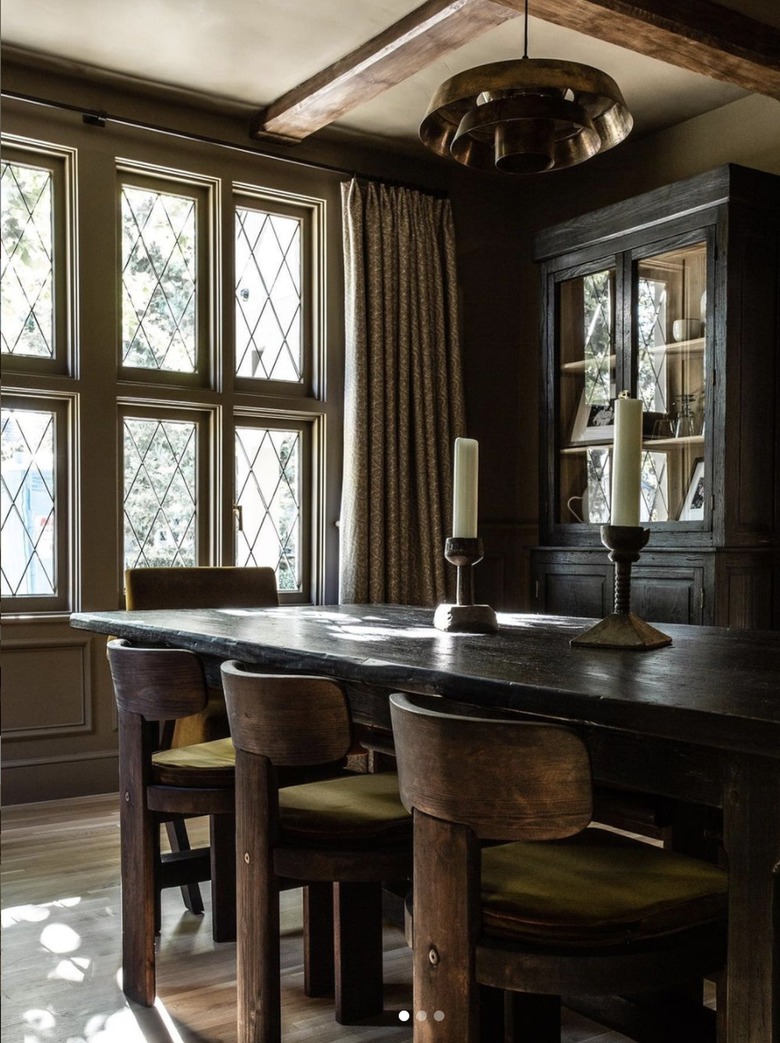 Dining room table with oversized candlesticks.