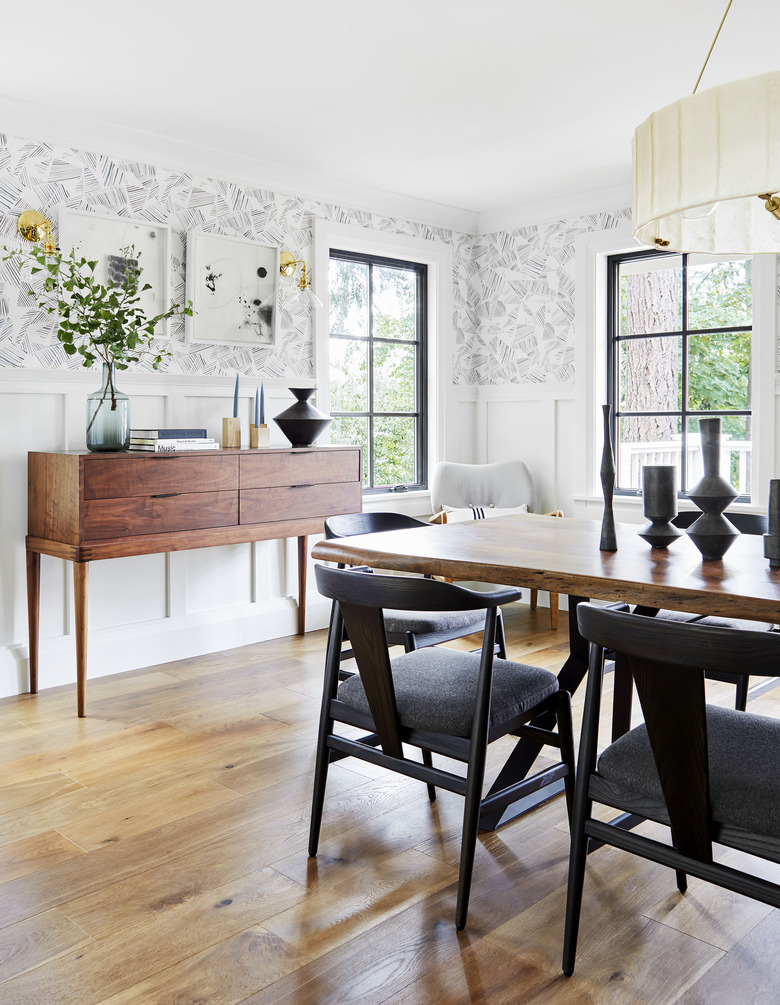 modern dining room with mixed wood finishes and credenza for storage