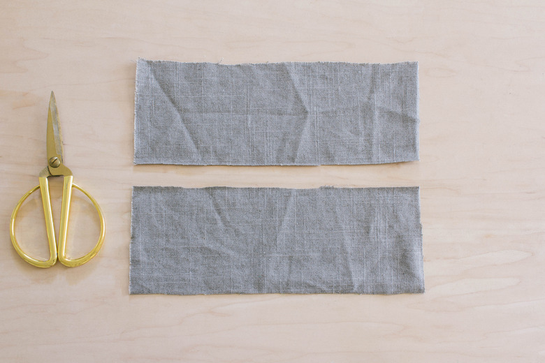 Two rectangles cut out of gray linen fabric