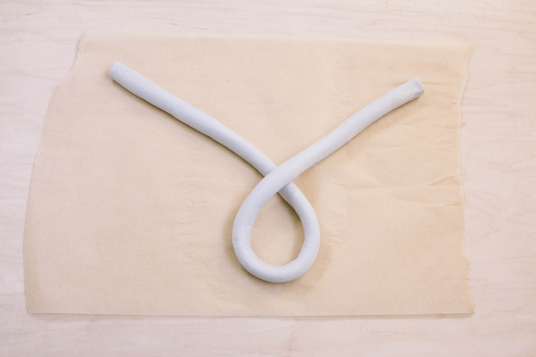 Tails of air dry clay shape crossed together