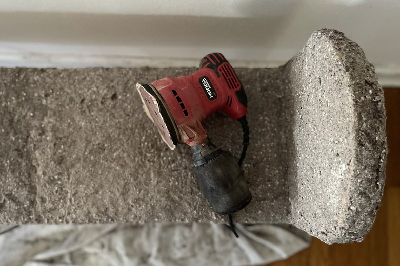 Power sander on top of dried bench