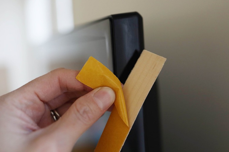 Peeling backing off wood veneer banding