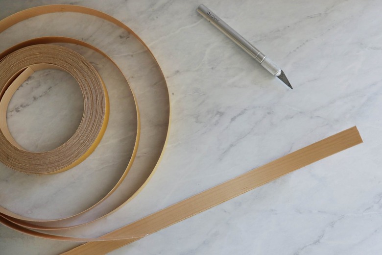 Cutting strips of wood veneer