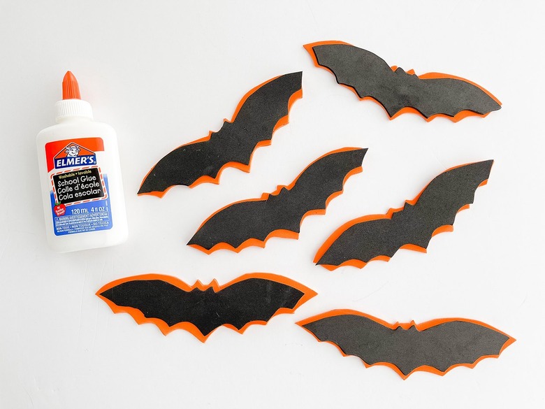 Glue the cut bat shapes on top of each other.