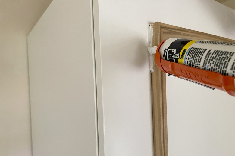 Caulking trim molding on IKEA PAX wardrobe