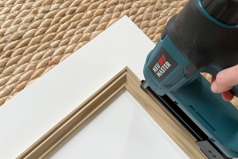 Brad nailing molding trim onto IKEA FORSAND door