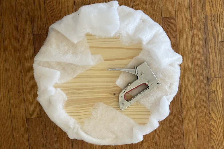 Batting stapled to back of wood circle