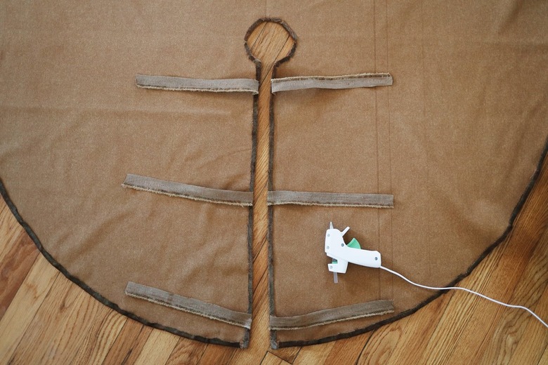 Three sets of ribbons glued along slit in tree skirt