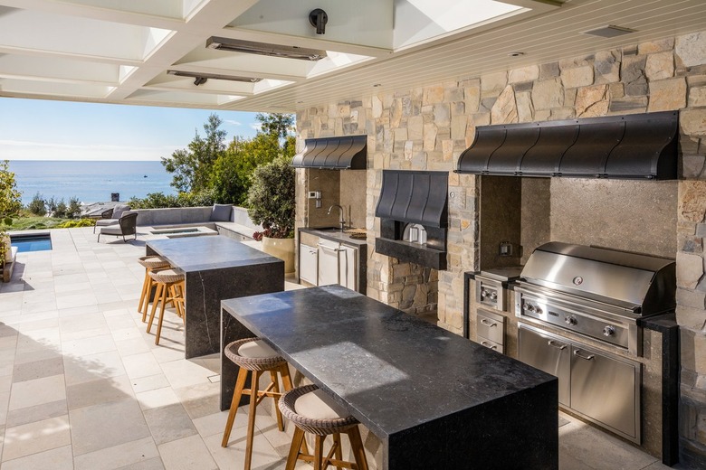 stone outdoor kitchen with double island