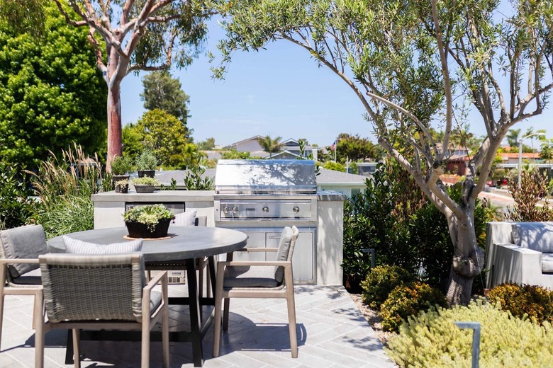 secluded outdoor kitchen with small dining area