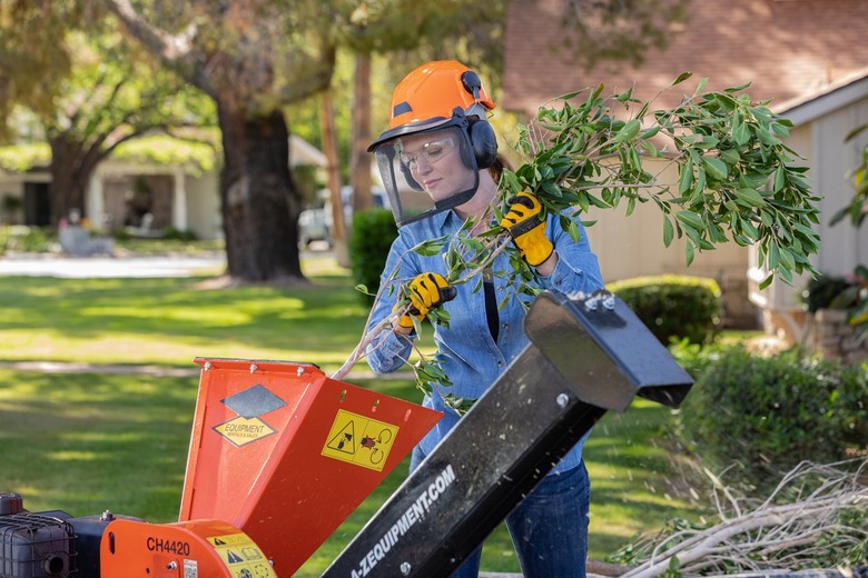 woman using a wood chipper