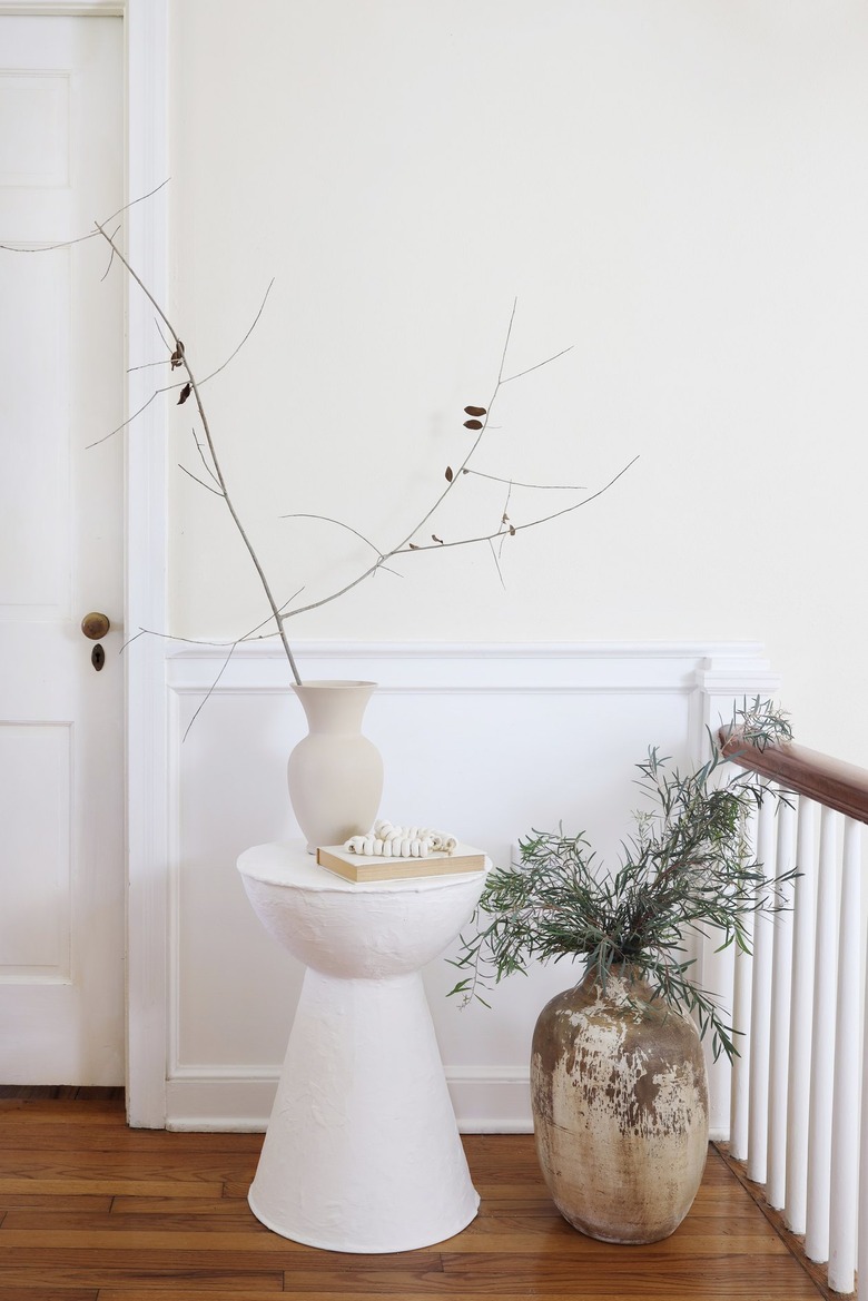 DIY plaster side table styled with vase and branches