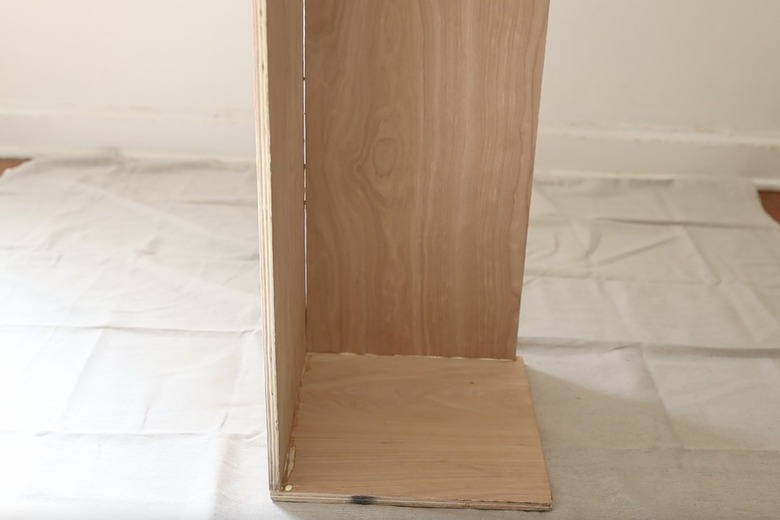 Gluing back and side pieces to bottom of plinth