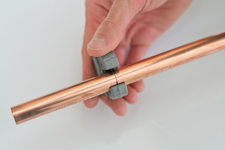 Use a pipe cutter to cut the pipe.