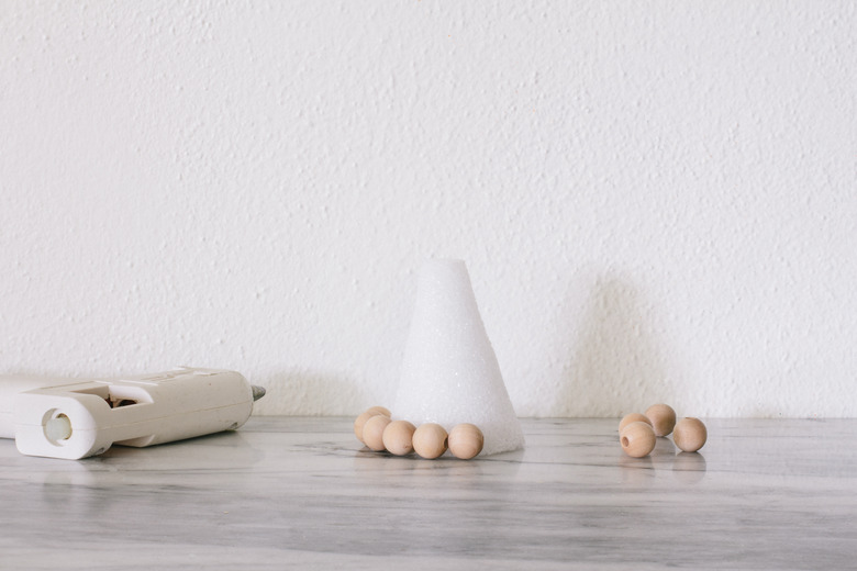 Gluing wood beads to foam cone