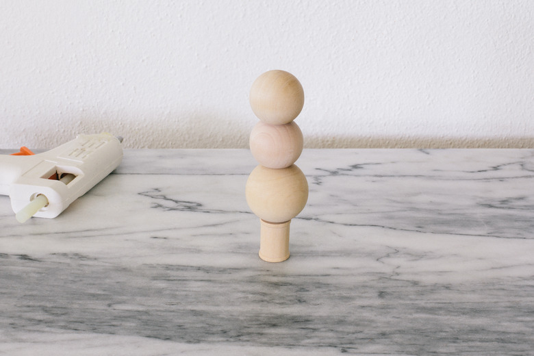 Gluing wooden beads to wooden spool