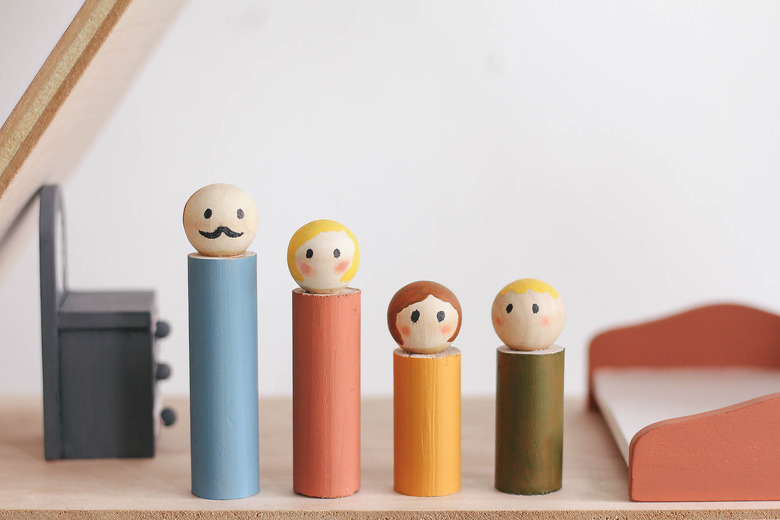 DIY wooden dolls inside dollhouse