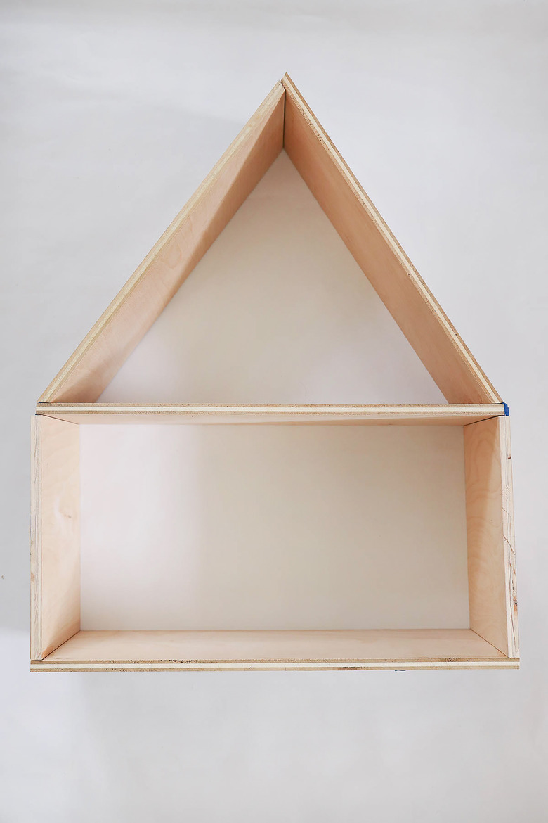 Top and bottom pieces of dollhouse joined together