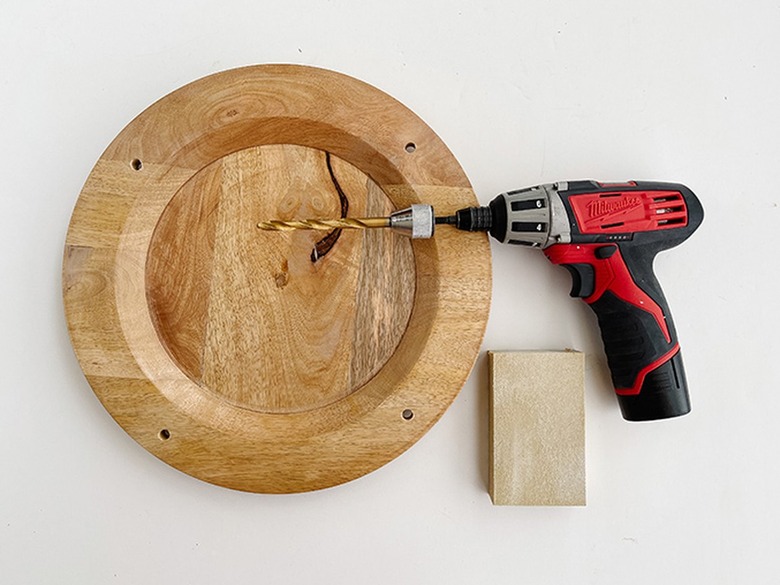 Drill through the holes with a drill