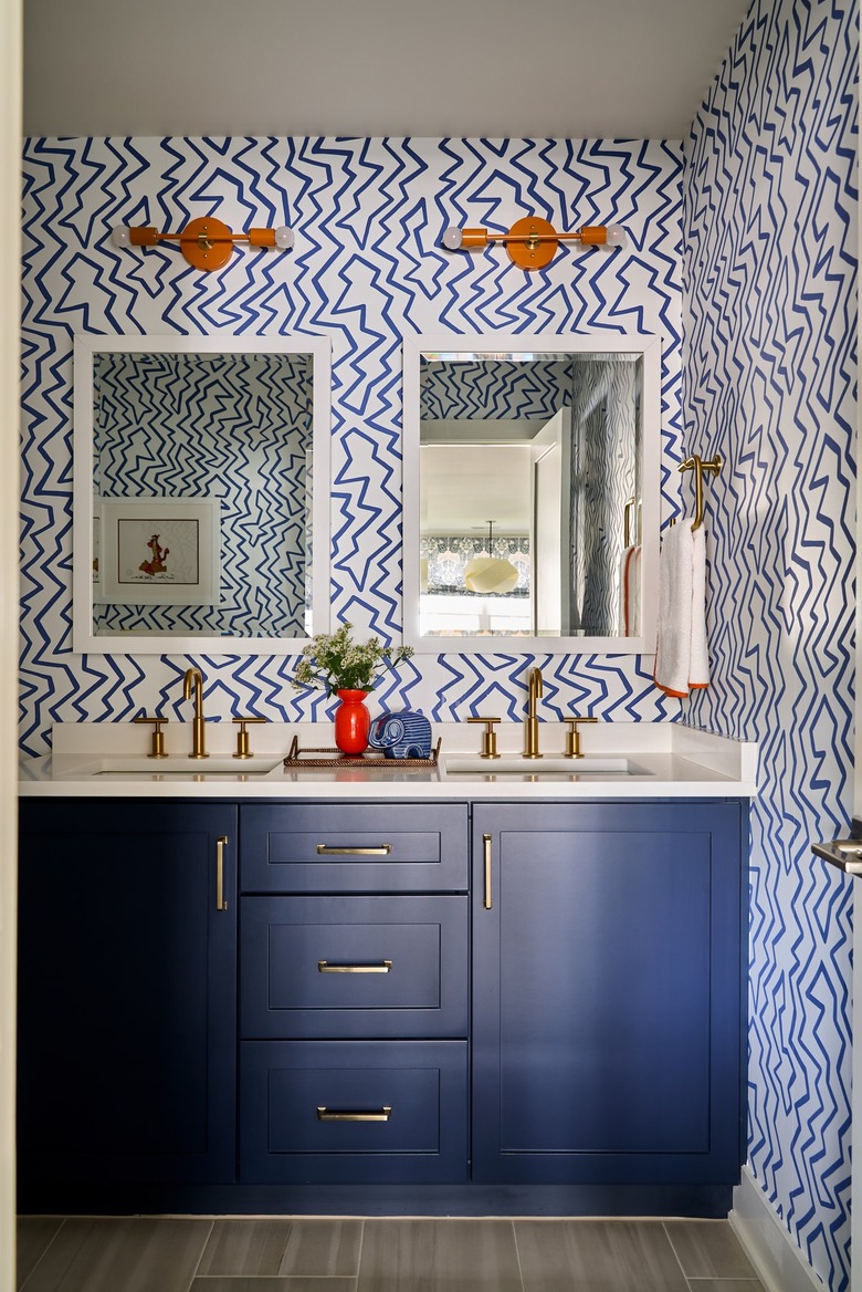 bathroom with orange sconces
