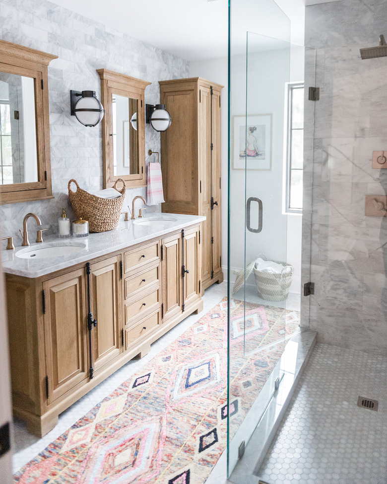 Double bathroom vanity with undermount sinks and bohemian decor