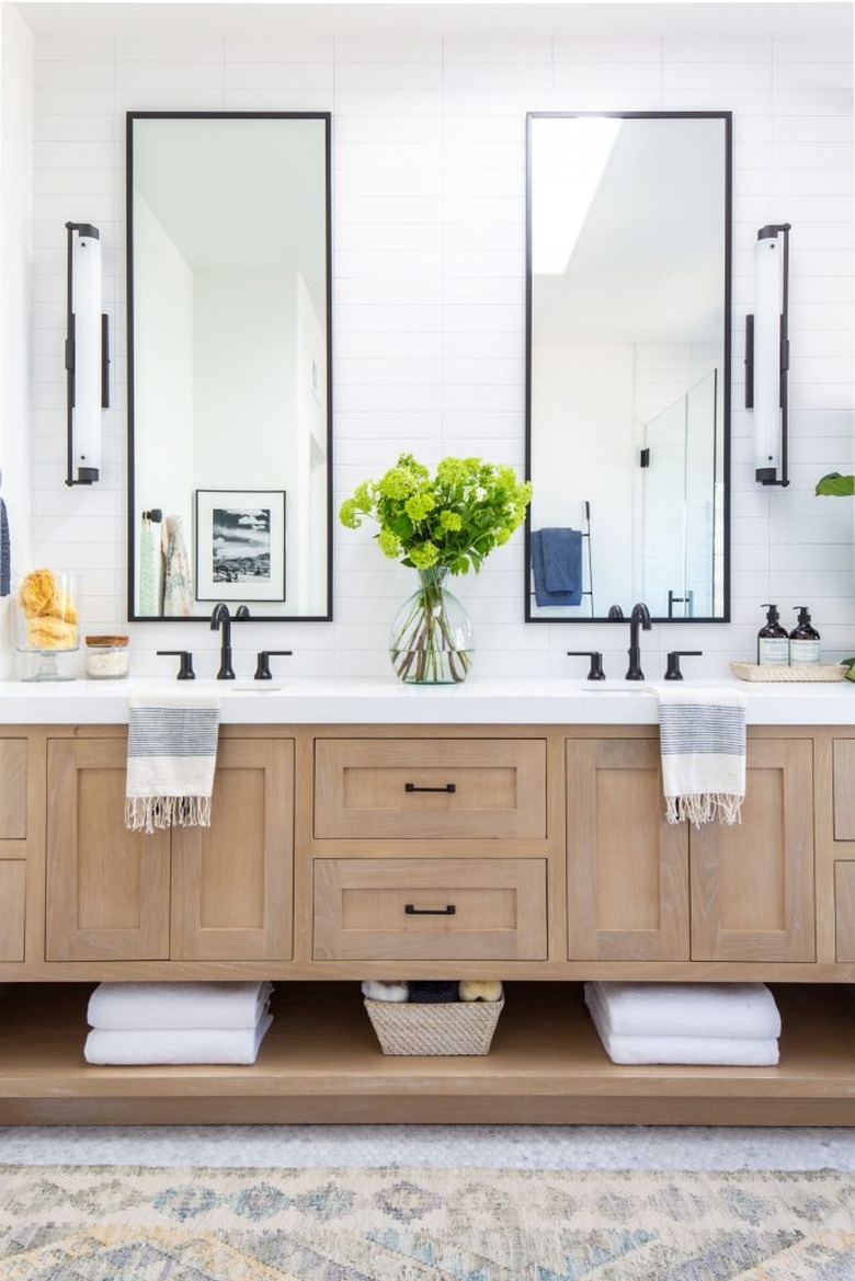 Double bathroom vanity with rectangular mirrors and wood cabinets