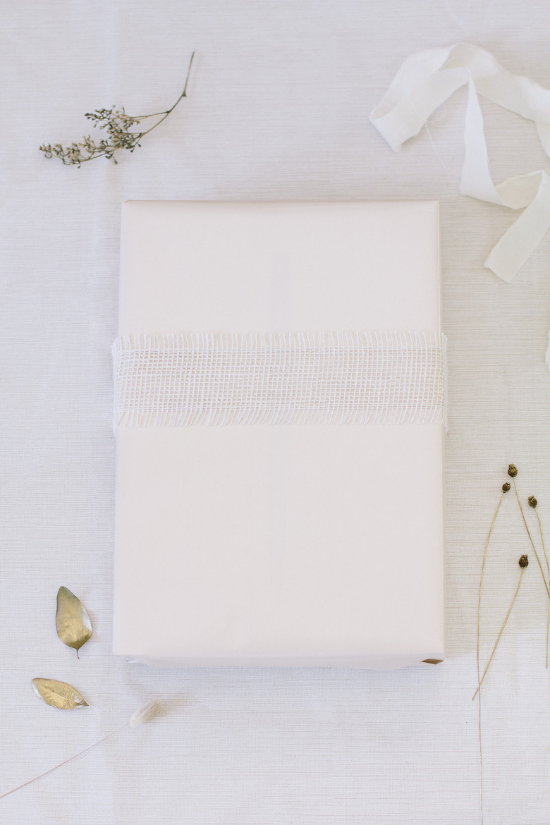 Wide burlap ribbon wrapped around box