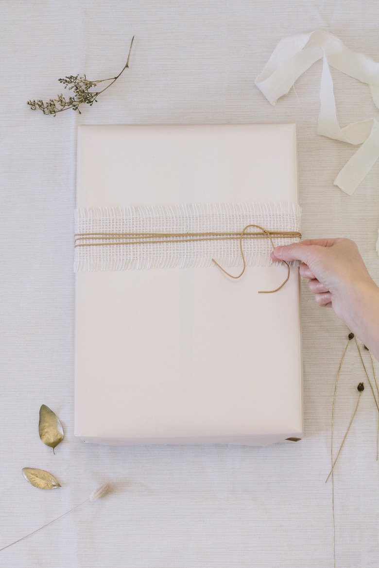 Leather cording wrapped on top of burlap ribbon