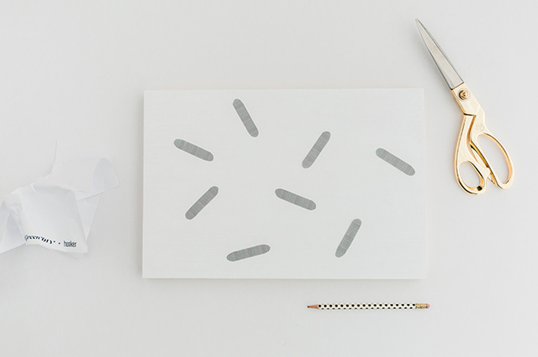 Print the template and cut out the shapes to trace on top of the painted wood surface.