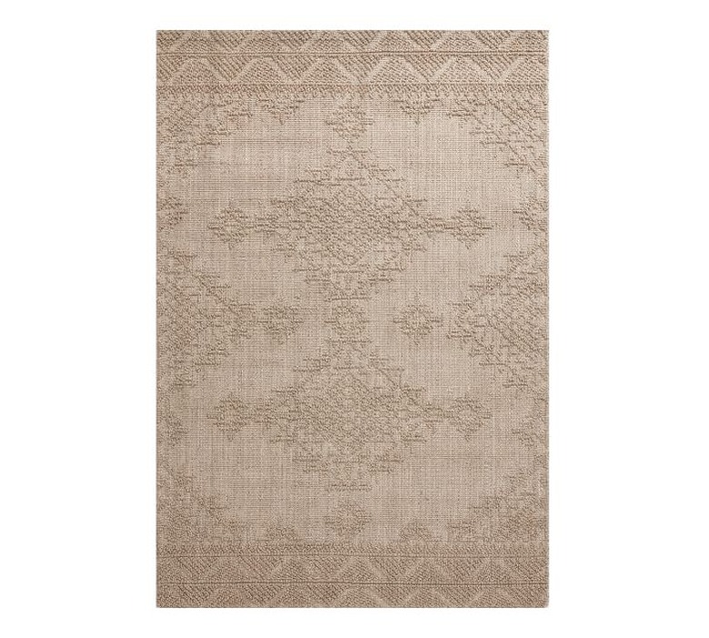 Cream eco-friendly rug with subtle geometric patterning