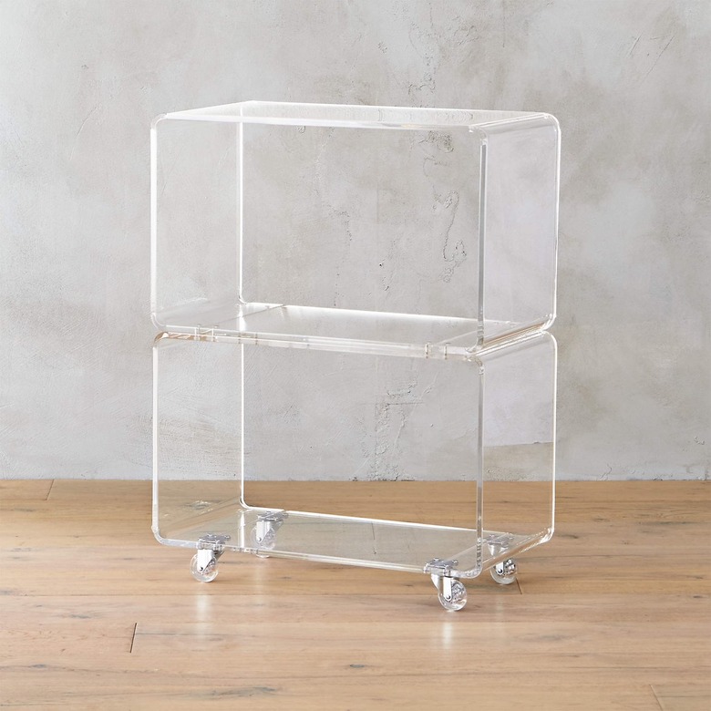A small clear shelving unit on wheels
