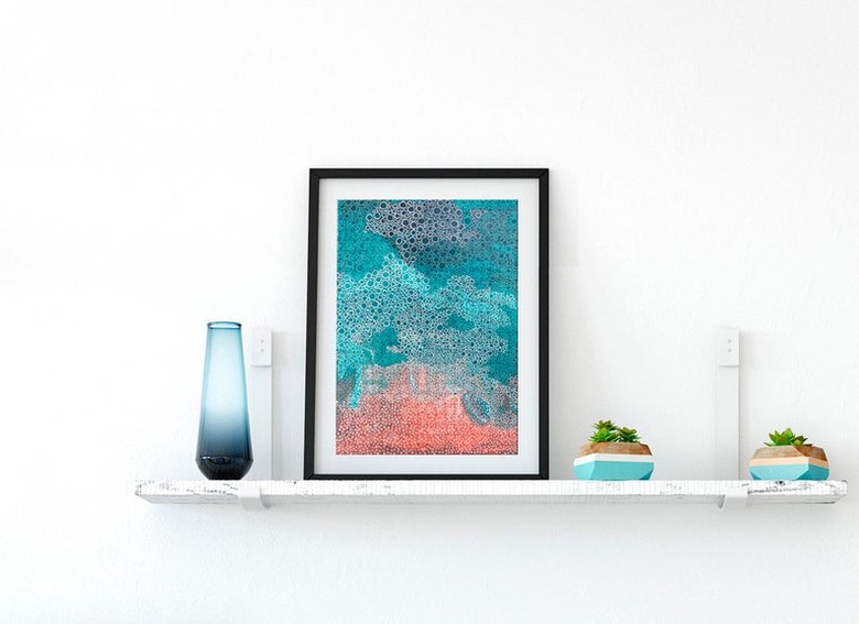 framed puzzle on a shelf