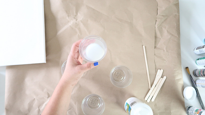 Pouring Medium in cup.
