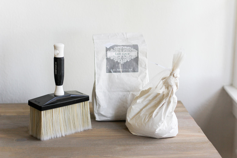 Limewash powder and masonry brush