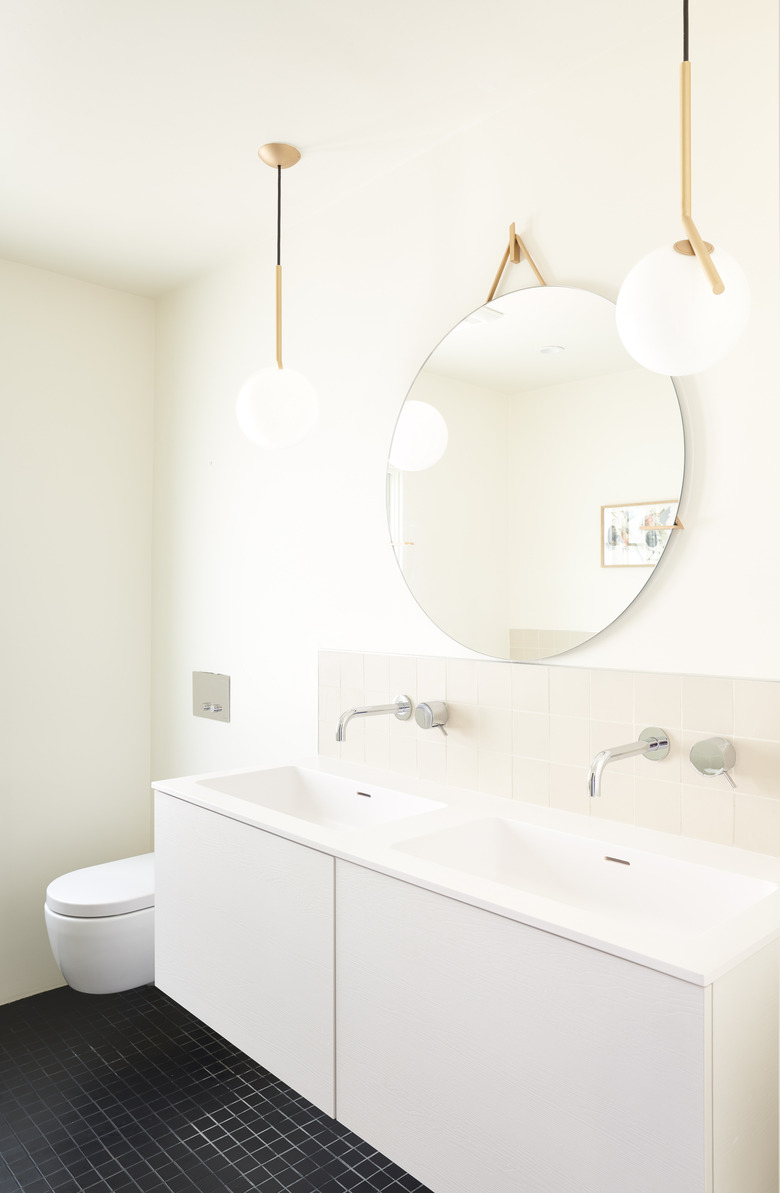 white bathroom with pendant lighting