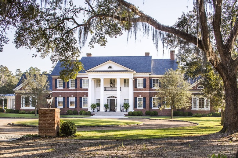 red brick house with black roof