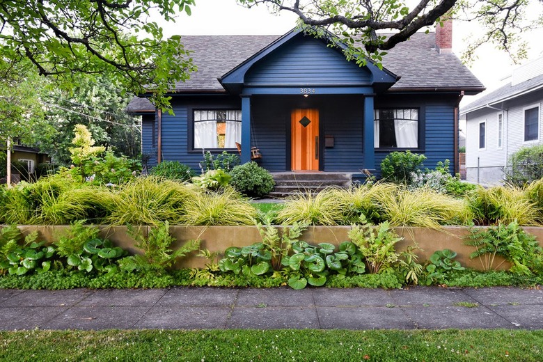 navy blue home exterior with black roof