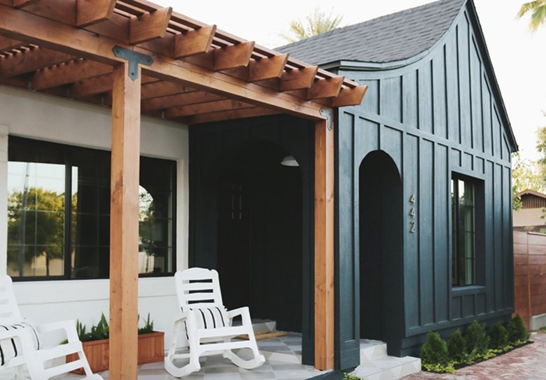 Dark forest green exterior with black windows