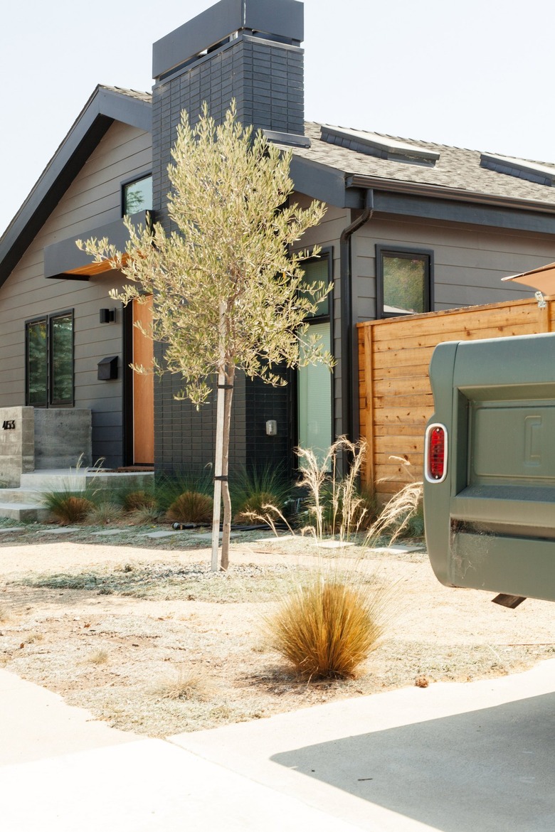 A dark gray house with black accents